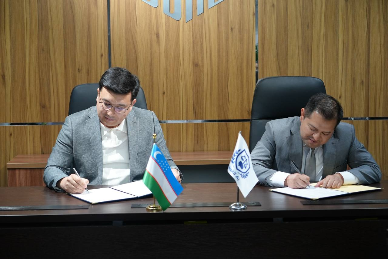 Wakil AI and UDAC delegates signing